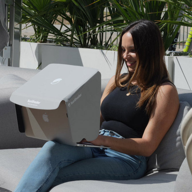 Who is most likely to use a laptop sun shade, laptop tent or laptop visor?